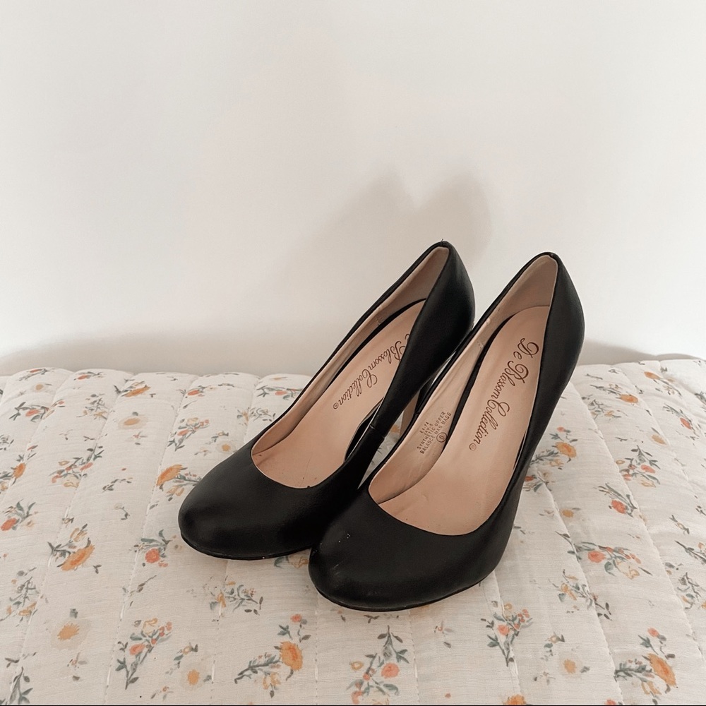 Black heels with gold band on the back